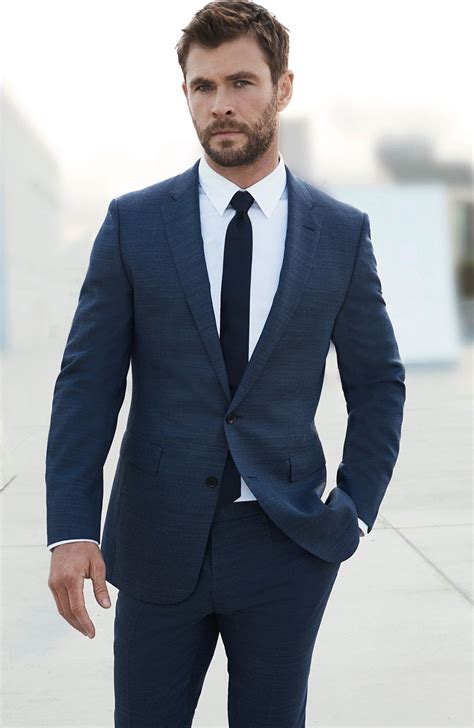 navy suit and black tie